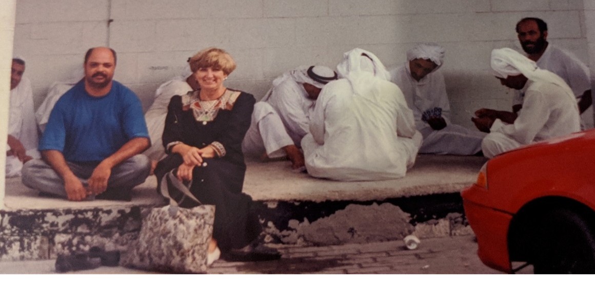 Lucia sitting with people of Bahrain