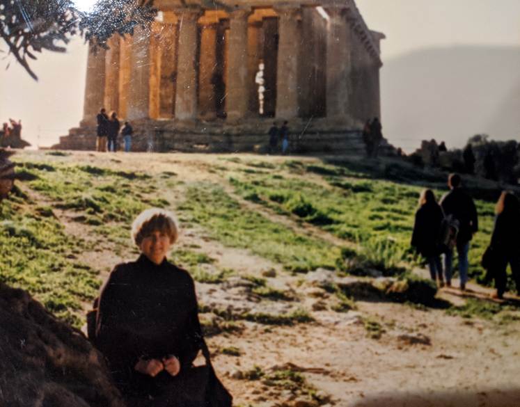 Lucia posing in front of a Greek temple in Agrigento, Sicily